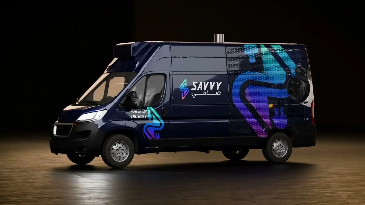 A 3D render of a dark blue commercial delivery van branded with the Savvy logo against a studio background.