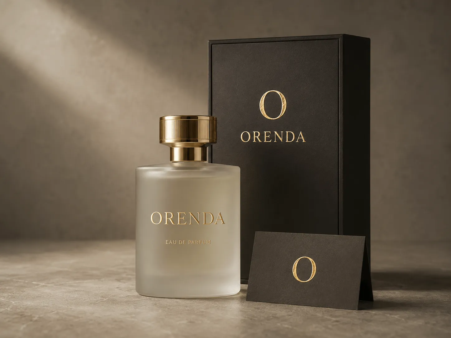 A frosted glass perfume bottle with a gold cap stands next to its black and gold luxury packaging box.